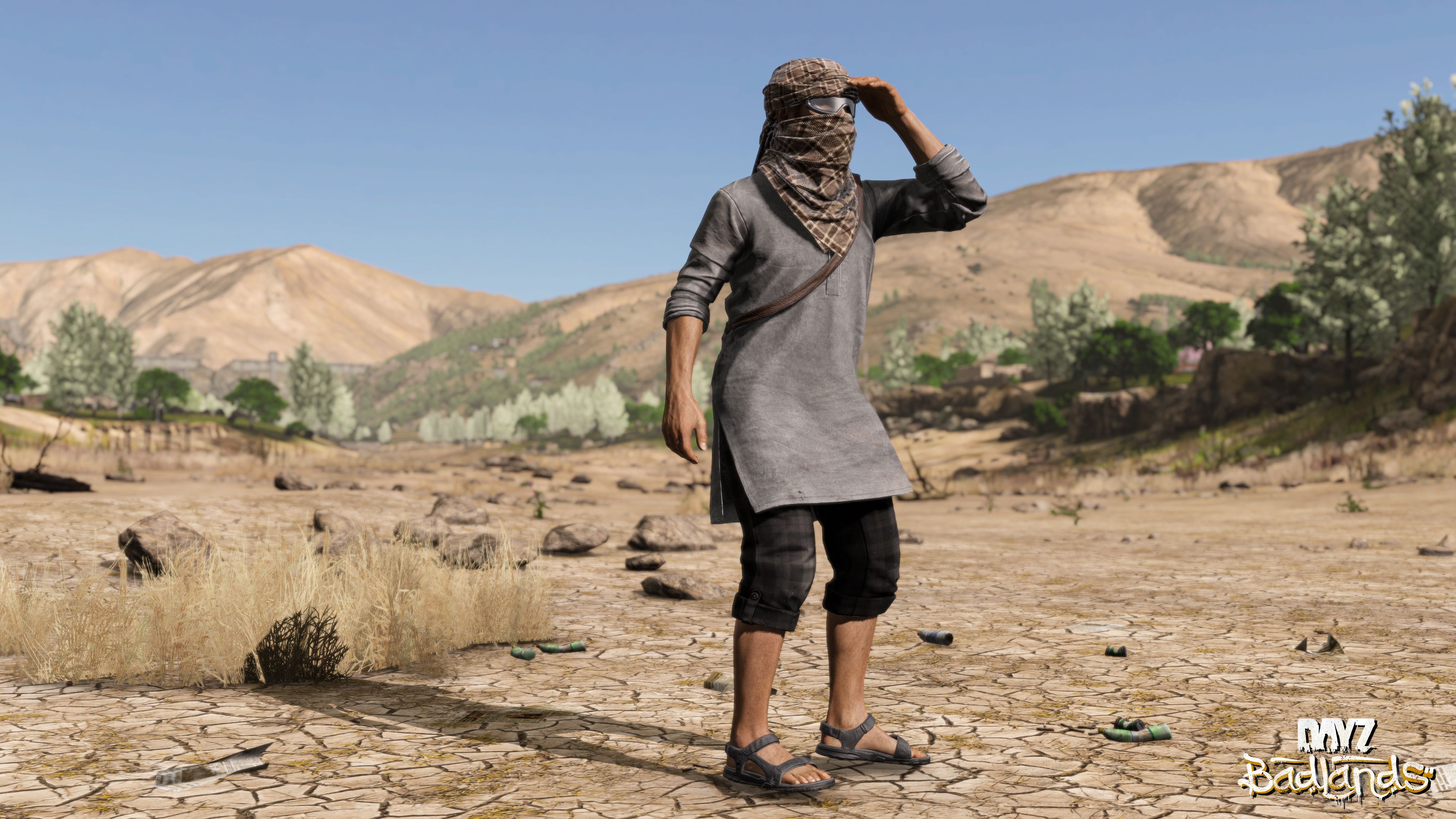 A survivor crossing open sunlit terrain in Nasdara